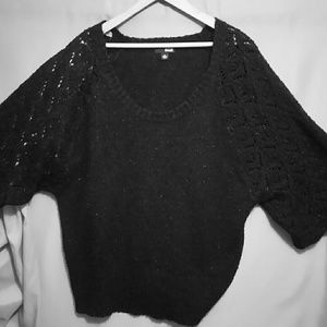 Knit black sparkle sweater with crochet details